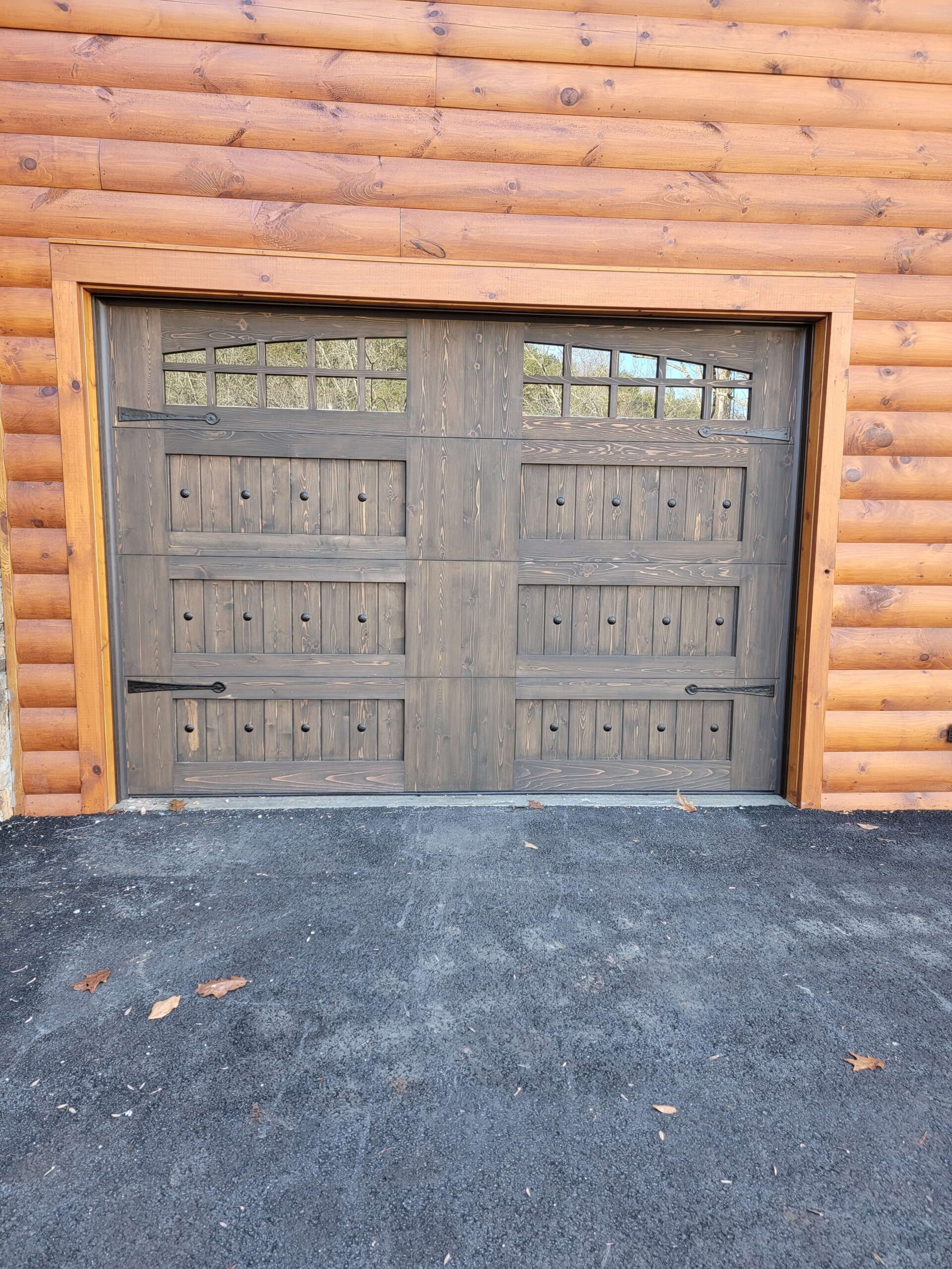 stained wood garage door with windows
